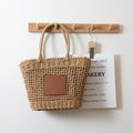 Sac de paille de Thaïlande Niche Rétro Sac à bandoulière portable évidé Tissé Sac de plage de vacances en bord de mer pour femmes