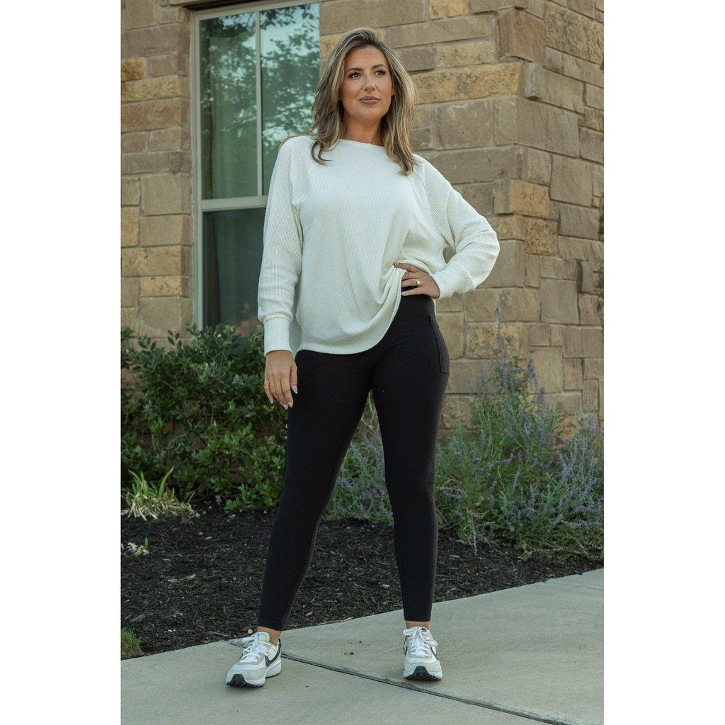 Lilla - Legging pleine longueur en molleton noir avec poches