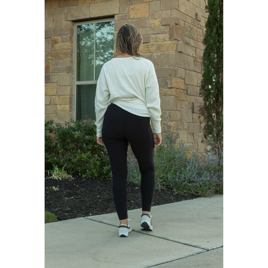 Lilla - Legging pleine longueur en molleton noir avec poches