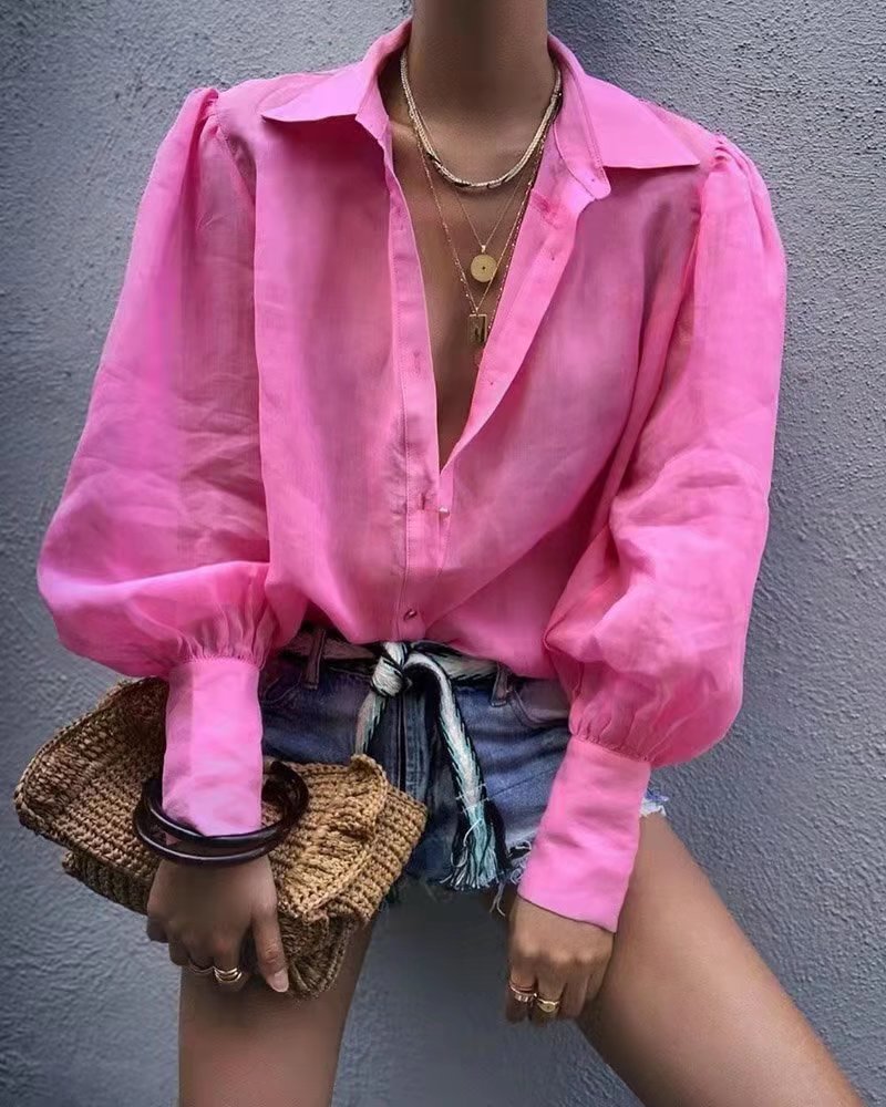 Pour chemise à manches longues en coton à col polo de couleur unie, boutonnée et à manches lanternes pour femme