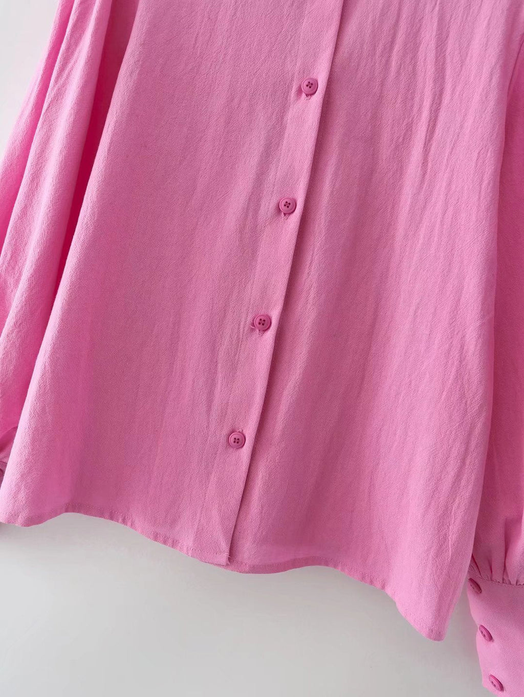 Pour chemise à manches longues en coton à col polo de couleur unie, boutonnée et à manches lanternes pour femme