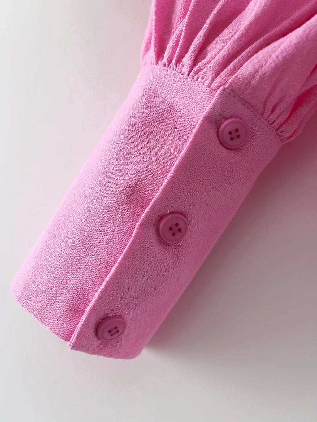 Pour chemise à manches longues en coton à col polo de couleur unie, boutonnée et à manches lanternes pour femme