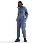Pantalon de jogging taille mi-haute en tissu Fleece technique Nike Sportswear pour femme - World Indigo