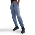 Pantalon de jogging taille mi-haute en tissu Fleece technique Nike Sportswear pour femme - World Indigo