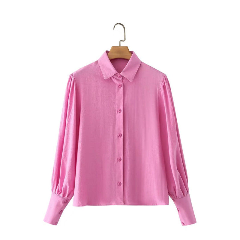 Pour chemise à manches longues en coton à col polo de couleur unie, boutonnée et à manches lanternes pour femme