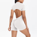 Combinaison courte à manches courtes avec découpes creuses au dos et fermeture éclair, combinaison de sport et de fitness à hanches pêche, dos nu, vêtements de yoga pour femmes