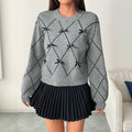 Pull doux d'automne-hiver à col rond avec nœud décoratif et losanges pour femme