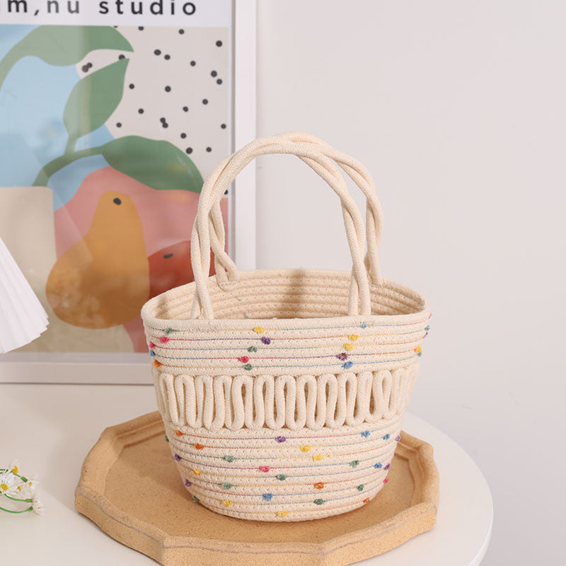 Süße bunte Mütze Kleine Korbtasche Nische Hohl geschnittene Eimer Gewebte Tasche Damen Handgehaltene Strohtasche